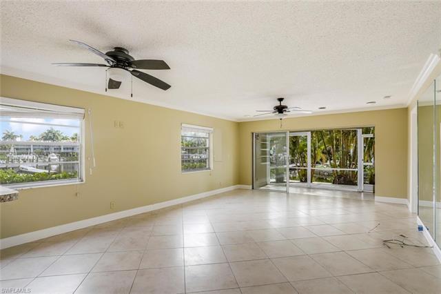 Empty living room at 1200 Cherrystone Ct B108, Naples